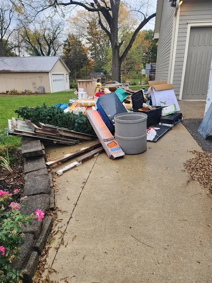Dumpster being loaded with debris for Roofing Dumpster Rental in Mount Airy
